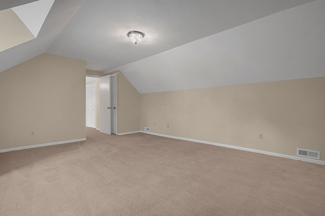 764 Towne Krier Ct, Newark, OH 43055 - bonus room featuring lofted ceiling and light carpet