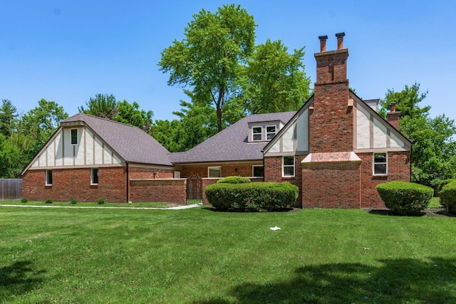 1120 Fairway Blvd, Columbus, OH 43213 - back of house with a chimney, brick siding, and a shingled roof