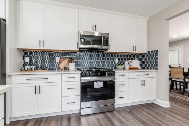 1120 Fairway Blvd, Columbus, OH 43213 - kitchen featuring stainless steel appliances, dark wood-type flooring, light countertops, and white cabinets