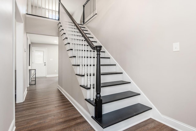 1120 Fairway Blvd, Columbus, OH 43213 - staircase with wood finished floors and a towering ceiling