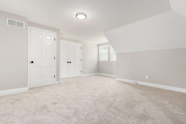 1120 Fairway Blvd, Columbus, OH 43213 - additional living space featuring light carpet and vaulted ceiling