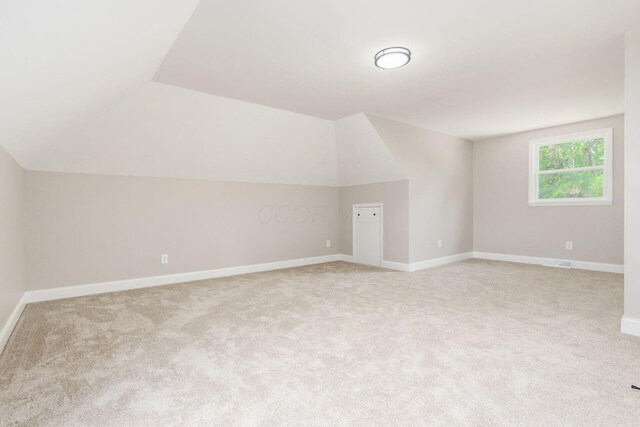1120 Fairway Blvd, Columbus, OH 43213 - additional living space with lofted ceiling and light carpet
