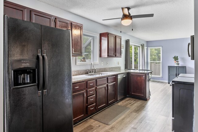 3124 Hillrose Dr, Hilliard, OH 43026 - kitchen with black fridge with ice dispenser, stainless steel dishwasher, ceiling fan, light wood-type flooring, and a textured ceiling