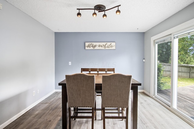 3124 Hillrose Dr, Hilliard, OH 43026 - dining area with a textured ceiling and wood finished floors