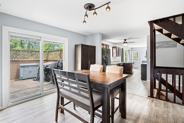 3124 Hillrose Dr, Hilliard, OH 43026 - dining area with a textured ceiling, light wood-style floors, and a ceiling fan