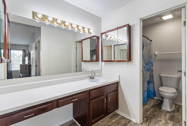 3124 Hillrose Dr, Hilliard, OH 43026 - full bath with a textured ceiling, wood finished floors, and vanity