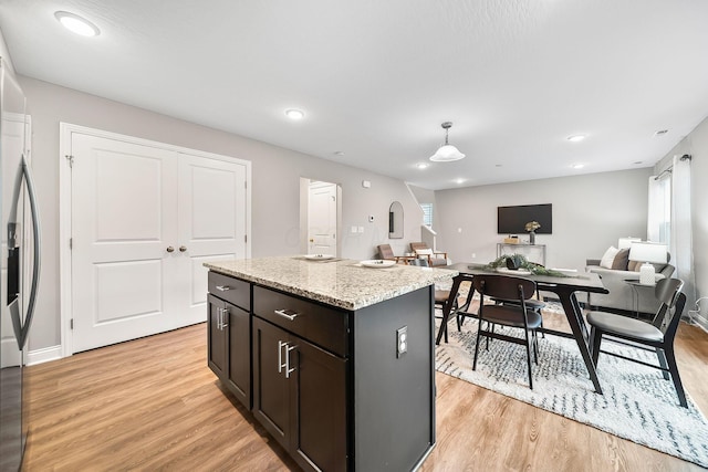 1364 Robinof Dr, Grove City, OH 43123 - kitchen with light wood-type flooring, plenty of natural light, a kitchen island, decorative light fixtures, and recessed lighting