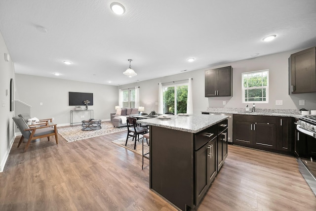 1364 Robinof Dr, Grove City, OH 43123 - kitchen featuring stainless steel appliances, plenty of natural light, a center island, light stone countertops, and recessed lighting