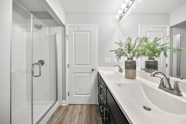 1364 Robinof Dr, Grove City, OH 43123 - full bath featuring double vanity, a stall shower, and wood finished floors