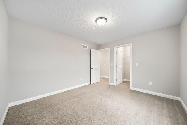 1364 Robinof Dr, Grove City, OH 43123 - unfurnished bedroom featuring carpet floors, a walk in closet, and a closet
