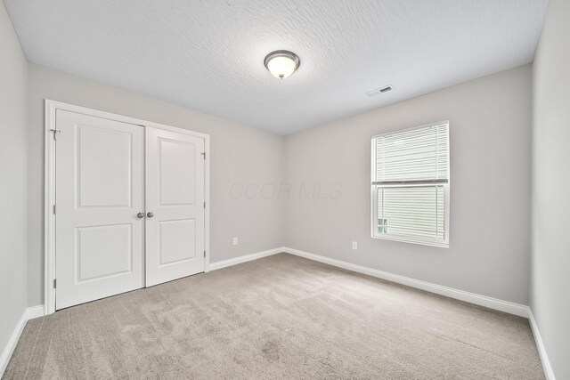 1364 Robinof Dr, Grove City, OH 43123 - unfurnished bedroom featuring carpet flooring and a closet