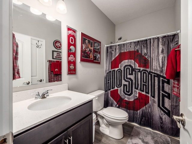 326 Mannaseh Dr W, Granville, OH 43023 - full bathroom featuring vanity, wood finished floors, curtained shower, and a textured ceiling