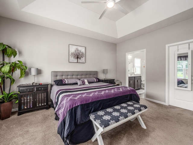 326 Mannaseh Dr W, Granville, OH 43023 - carpeted bedroom featuring multiple windows, a raised ceiling, connected bathroom, and ceiling fan