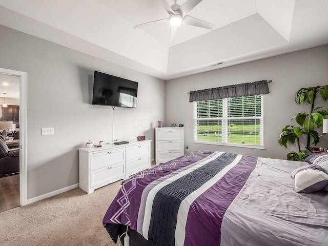 326 Mannaseh Dr W, Granville, OH 43023 - bedroom with light colored carpet, a tray ceiling, and a ceiling fan