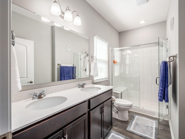 326 Mannaseh Dr W, Granville, OH 43023 - full bath with a shower stall, double vanity, and wood finished floors