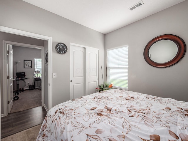 326 Mannaseh Dr W, Granville, OH 43023 - bedroom featuring dark carpet, a closet, and dark wood-style floors