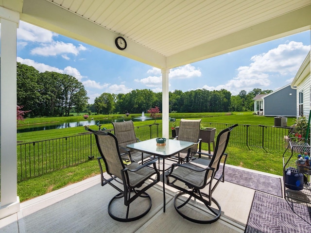 326 Mannaseh Dr W, Granville, OH 43023 - view of patio / terrace featuring a water view, outdoor dining area, and view of scattered trees