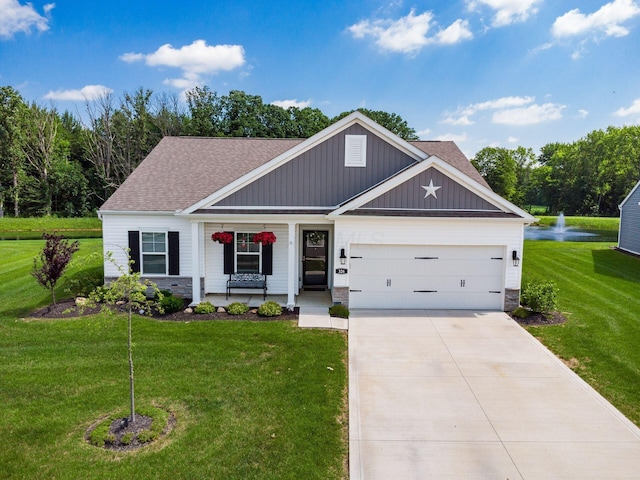326 Mannaseh Dr W, Granville, OH 43023 - view of front of house featuring an attached garage, a front lawn, covered porch, concrete driveway, and a shingled roof