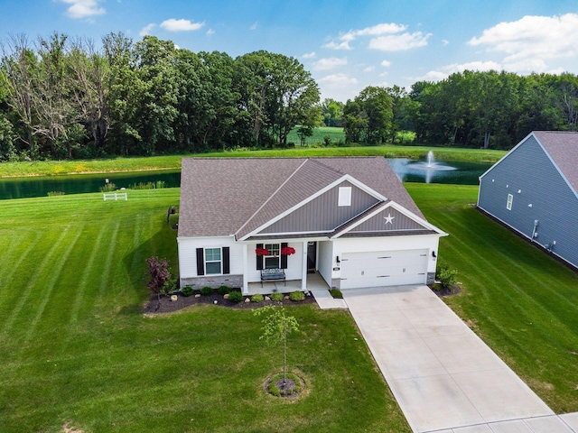 326 Mannaseh Dr W, Granville, OH 43023 - view of front facade featuring a water view, a garage, a front yard, driveway, and stone siding
