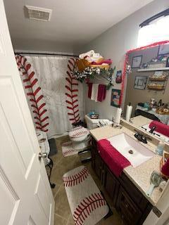 5510 Coopers Hawk Cir, Dublin, OH 43016 - bathroom featuring vanity, a shower with shower curtain, and tile patterned floors