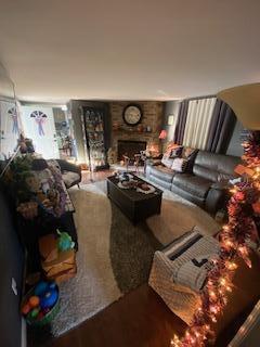 5510 Coopers Hawk Cir, Dublin, OH 43016 - living area with wood finished floors and a brick fireplace
