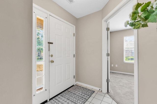 9460 Clermont Cir, Powell, OH 43065 - entrance foyer featuring light tile patterned flooring and light colored carpet