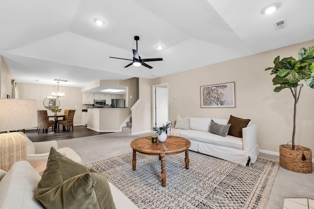 9460 Clermont Cir, Powell, OH 43065 - living room with a ceiling fan, stairs, carpet, a chandelier, and recessed lighting