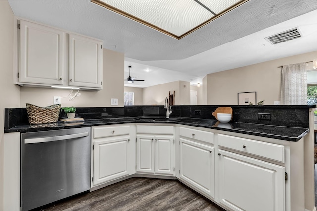 9460 Clermont Cir, Powell, OH 43065 - kitchen with stainless steel dishwasher, dark wood-style flooring, white cabinetry, and a ceiling fan