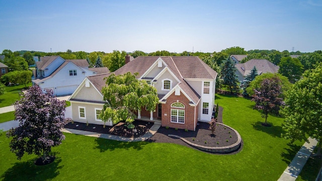 5866 Morganwood Sq, Hilliard, OH 43026 - view of front of property featuring a front lawn, stucco siding, and a chimney