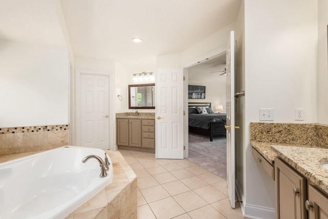 5866 Morganwood Sq, Hilliard, OH 43026 - ensuite bathroom with two vanities, a bath, tile patterned floors, and ceiling fan