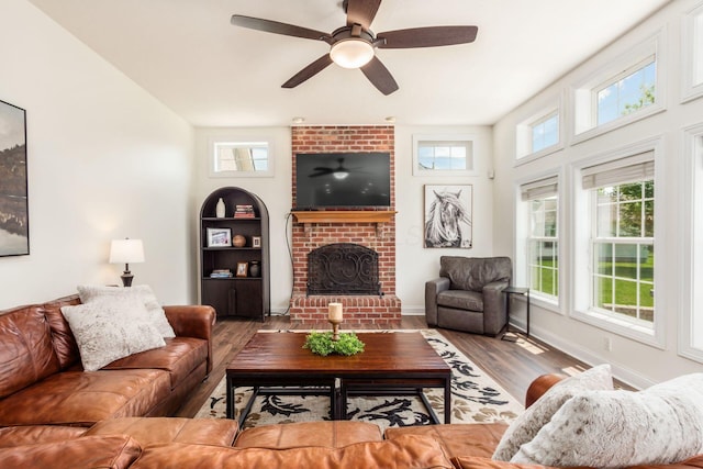 5866 Morganwood Sq, Hilliard, OH 43026 - living area featuring wood finished floors, a fireplace, and ceiling fan