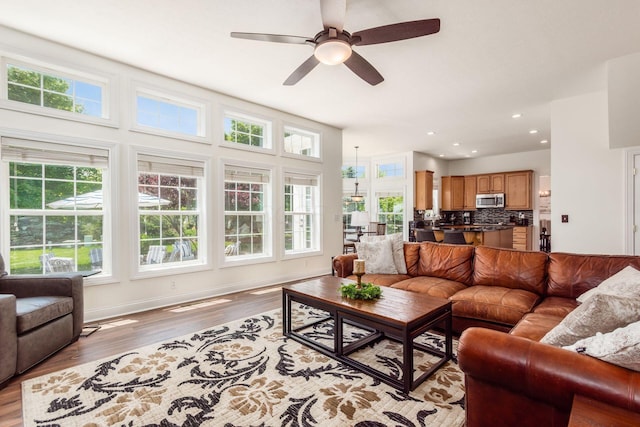 5866 Morganwood Sq, Hilliard, OH 43026 - living area with light wood-type flooring, ceiling fan, and recessed lighting