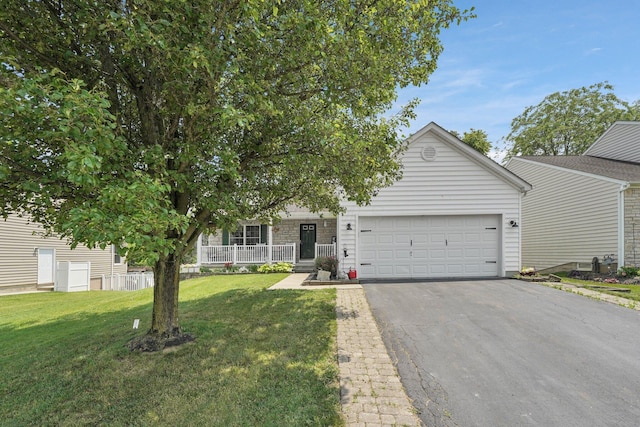 5405 Boucher Dr, Orient, OH 43146 - view of property hidden behind natural elements featuring a garage, asphalt driveway, covered porch, and a front lawn