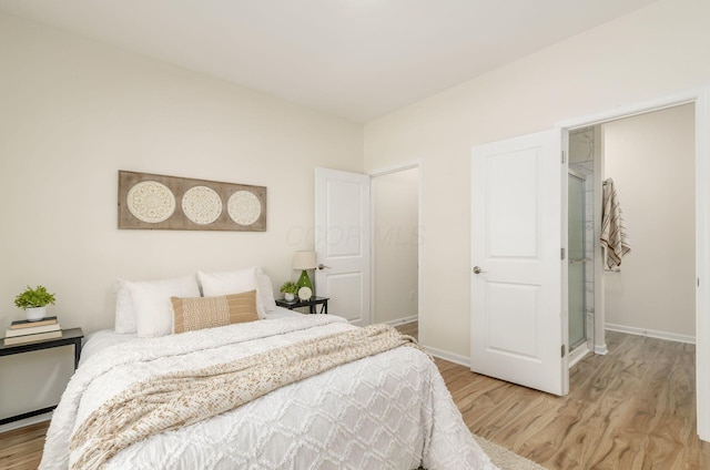 605 Frebis Ave, Columbus, OH 43206 - bedroom featuring light wood-type flooring and baseboards