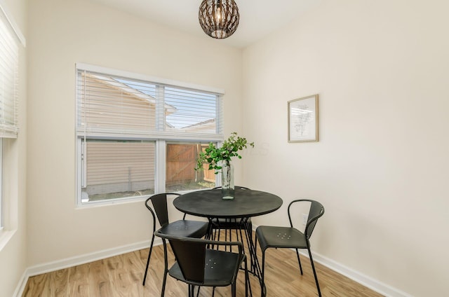 605 Frebis Ave, Columbus, OH 43206 - dining room with wood finished floors and a chandelier