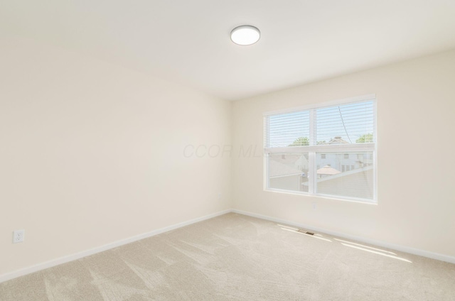 605 Frebis Ave, Columbus, OH 43206 - spare room featuring light carpet