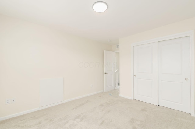605 Frebis Ave, Columbus, OH 43206 - unfurnished bedroom featuring light colored carpet and a closet