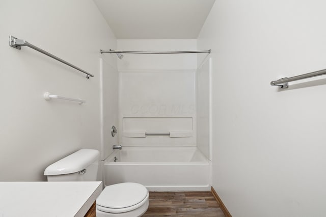 223 E 2nd St, Mansfield, OH 44902 - bathroom with vanity, wood finished floors, and bathing tub / shower combination