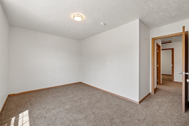 223 E 2nd St, Mansfield, OH 44902 - empty room with carpet, a textured ceiling, and a smoke detector