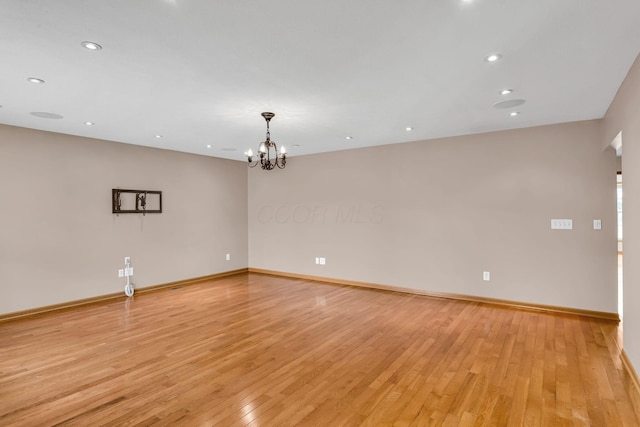 159 Hathaway Rd, West Jefferson, OH 43162 - empty room with a chandelier, light wood finished floors, and recessed lighting