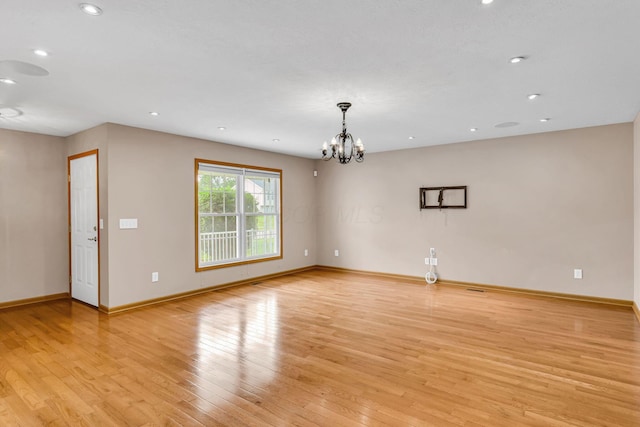 159 Hathaway Rd, West Jefferson, OH 43162 - unfurnished room with light wood-style floors, a chandelier, and recessed lighting