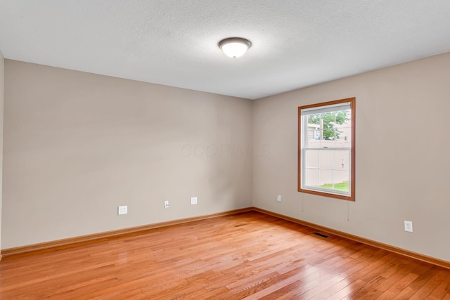 159 Hathaway Rd, West Jefferson, OH 43162 - unfurnished room featuring light wood finished floors and a textured ceiling