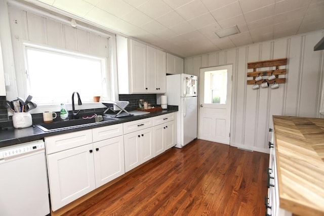 93 E 6th St, Fredericktown, OH 43019 - kitchen featuring white appliances, white cabinetry, dark wood-style flooring, and tasteful backsplash