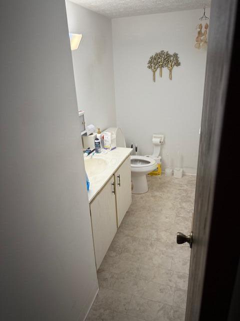 3841 Queen Anne Pl Unit A29, Grove City, OH 43123 - bathroom featuring vanity, a textured ceiling, and tile patterned floors