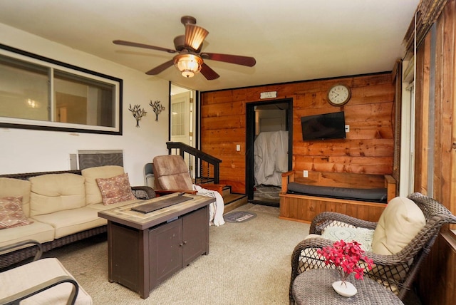 169 Myers Ave, Buckeye Lake, OH 43008 - living room with light carpet, wooden walls, and a ceiling fan