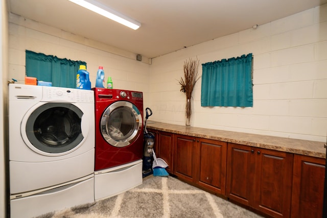 169 Myers Ave, Buckeye Lake, OH 43008 - laundry area featuring washing machine and dryer, cabinet space, light carpet, and concrete block wall