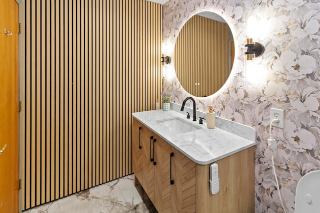 168 Thornapple Trl, Delaware, OH 43015 - bathroom featuring wallpapered walls, vanity, and marble finish flooring