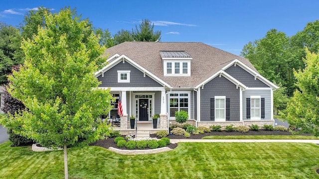 3017 Highland Woods Blvd, New Albany, OH 43054 - craftsman-style house with a front lawn, a porch, stone siding, and roof with shingles