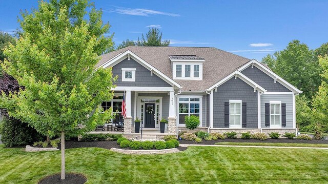 3017 Highland Woods Blvd, New Albany, OH 43054 - craftsman-style house featuring a front yard, a porch, and roof with shingles