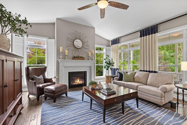 3017 Highland Woods Blvd, New Albany, OH 43054 - living room featuring ceiling fan, wood finished floors, vaulted ceiling, and a fireplace